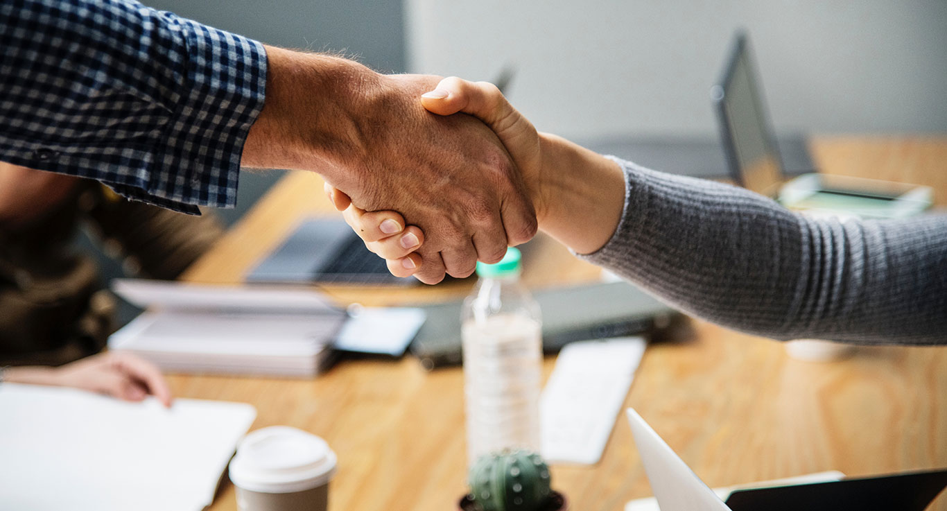 photo of people shaking hands